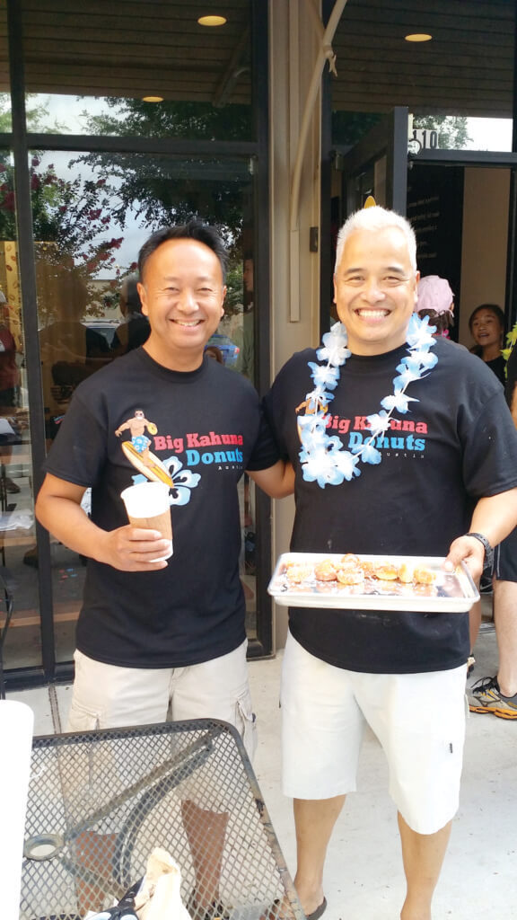 Two of Big Kahuna Donuts co-owners Dennis de la Paz and Rey Patriarca handed out samples at Saturday's grand opening.