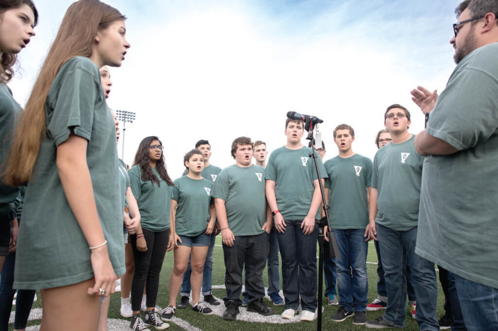 The Vandegrift HIgh School Choir performs the national anthem during a high school football game between the Vandegrift Vipers and the Permian Panthers at Monroe Stadium in Austin, Texas, on August 26, 2016