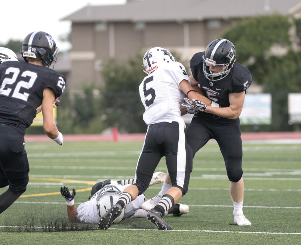 Vandegrift Vipers senior wide receiver Will Bruner (5) fights for posession after a catch during a high school football game between the Vandegrift Vipers and the Permian Panthers at Monroe Stadium in Austin, Texas, on August 26, 2016