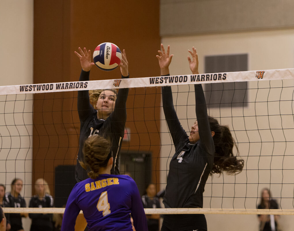 Vandegrift Vipers seniormiddle blocker Effie Zielinski (16) and senior outside hitter Katarina Mendez (4) in action during a high school volleyball game between the Vandegrift Vipers and the Sanger Indians at Westwood High School in Austin, Texas on August 11, 2016.