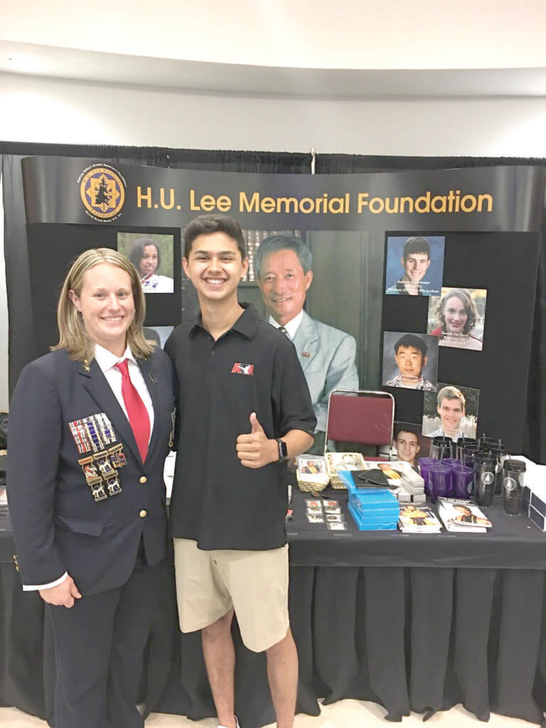 Cedar Park taekwondo studio owner and instructor Master CJ Barrettt and Antonio Cordova with a display about the H.U. Lee Memorial Foundation, which sponsors the scholarship Cordova received from the ATA. (Photos courtesy of Emilio Cordova)