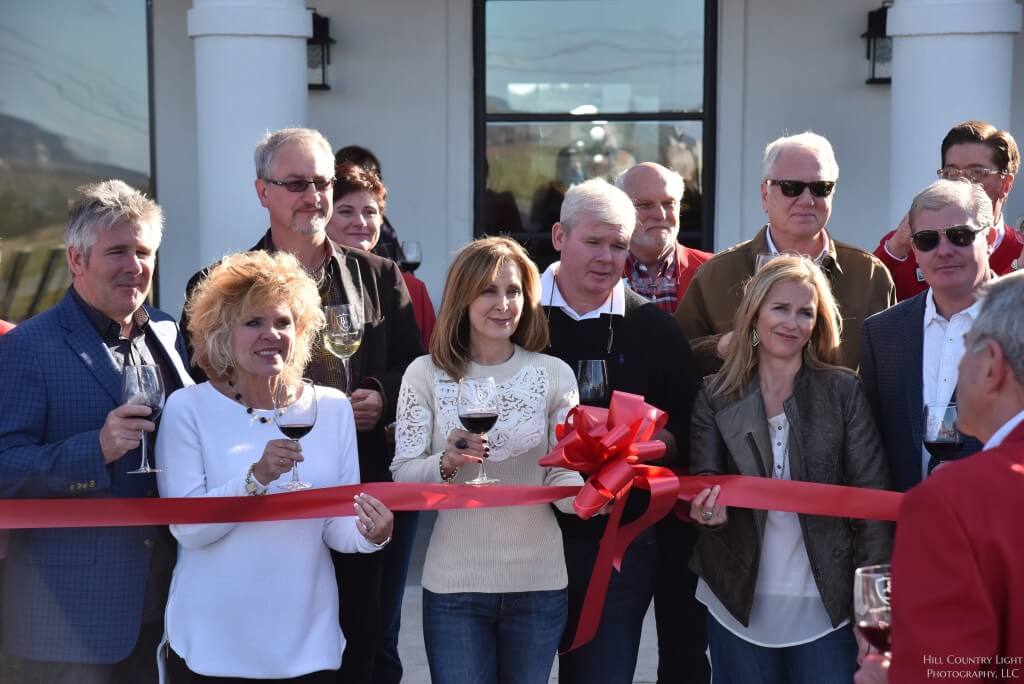 The Chase brothers, their wives, and others recently celebrated a ribbon cutting ceremony for the Barons Creek Vineyard, which they opened in Fredericksburg this year.