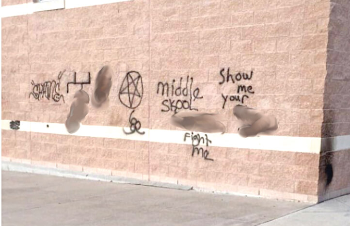 Graffiti was painted on an exterior wall of Canyon Ridge Middle School over the weekend of Oct. 22-23. (Parts of the image have been blurred for this story.) The spraypaint has since been removed with power washing and sandblasting. 