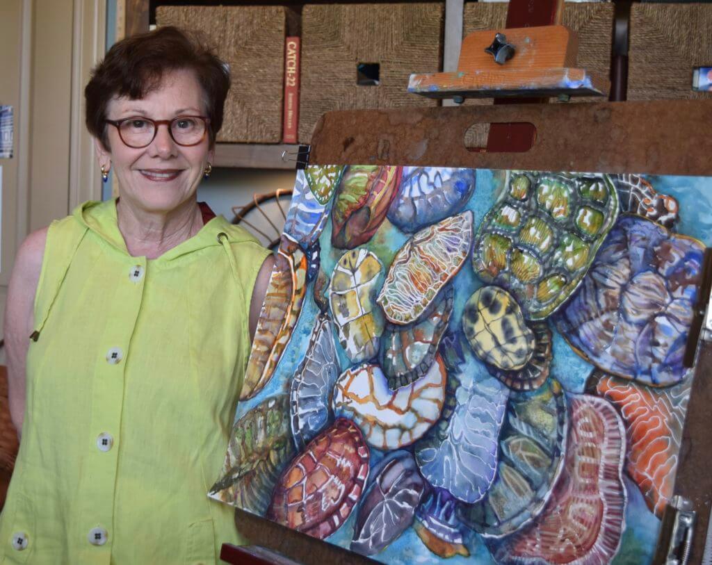 Local artist, Carol Sue Witt, said many things inspire her watercolor paintings, including a pile of turtle shells recaptured here.