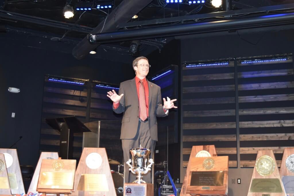 Leander ISD superintendent, Dr. Bret Champion, makes the 2015 State of the District presentation behind a display of awards earned last year by the district. The luncheon event was held Friday at Hill Country Bible Church. Photo by Kim Estes