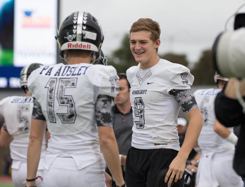Vandegrift Vipers senior wide receiver Paxton Segina (9) congratulates his teammates during the Class 5A, Division I regional semifinal playoff game at Alamo Stadium in San Antonio on Friday, November 27, 2015. Because of Vandegrift and Leander ISD concussion protocol,  Segina was on the sidelines, unable to play at the game against East View, several games after he was airlifted from a home game where he encountered a concussion after a hit. “As a staff, we are so thrilled to see Paxton make a full recovery and further his football career at Stanford University,” said Drew Sanders, VHS athletic director and head football coach.   