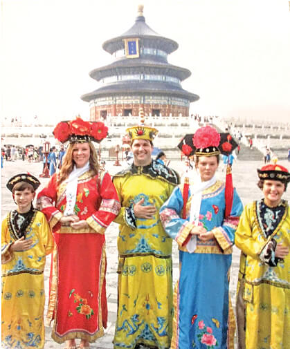 The Perardi family in traditional royal costumes at the Temple of Heaven in Beijing, China. The family drew a lot of attention and were photographed by Chinese tourists for 40 minutes. From left: Arys, Rachel, Eric, Ryleigh and Matteo Perardi.