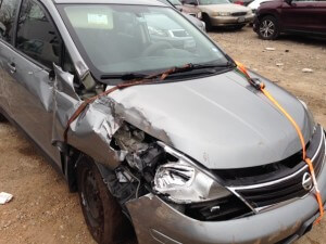 Delivery driver Brian Yoes’ 2011 Nissan Versa is damaged following a Dec. 28 incident during which five teens stole the car and drove it through a fence at the Tintara at Canyon Creek Apartments.