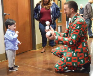 Juggler, Taylor Griswold, has this little one’s full attention.