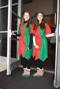 Elfin greeters – Skylar Cheatham and Jordan Hill at Saturday with Santa at ACF.