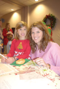 Sloane Thomen and her mother, Shae, work on her letter to Santa.