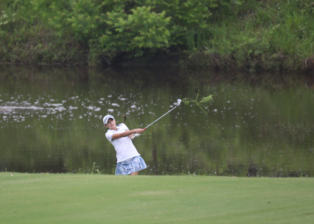 Abbie Dunn of Vandegrift High School hits out of the rough at the UIL Class 5A state golf tournament at Wolfdancer Golf Club in Cedar Creek.