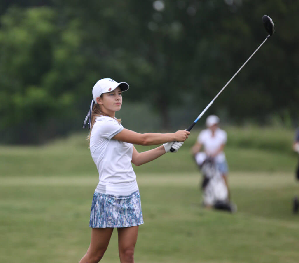 Sarah Beamer of Vandegrift High School watches a tee shot sail down the fairway at the UIL Class 5A state golf tournament at Wolfdancer Golf Club in Cedar Creek.
