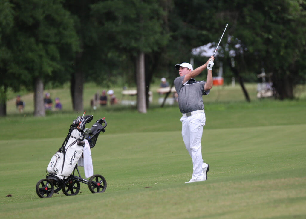 Tobin Niblett of Vandegrift High School hits off the fairway at the UIL Class 5A state golf tournament at Wolfdancer Golf Club in Cedar Creek.