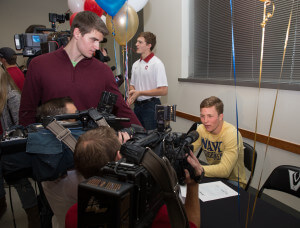 Vandegrift High School senior running back Travis Brannan talks with reporters on National Signing Day, Feb. 3, 2016, about his commitment to the United States Naval Academy, where he will play football.